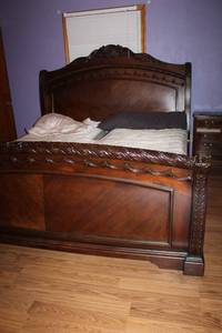 lot 193 image: Dark Wood King Size Bed Frame with Carved Details