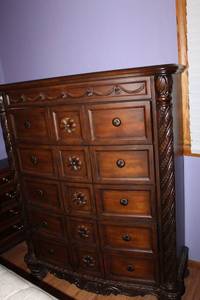 lot B-194 image: Carved Wood Bedroom Chest with 12 Drawers and Ornate Detailing