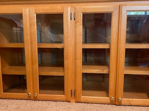 lot 1 image: Wood and Glass 4-Door Display Cabinet with Shelves