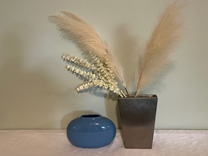 lot 2 image: Lot of 2 Decorative Vases - Blue Ceramic and Tall Metal Vase with Dried Floral Stems
