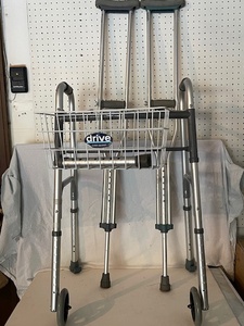 lot 39 image: Drive Medical Walker with Basket and Pair of Adjustable Aluminum Crutches