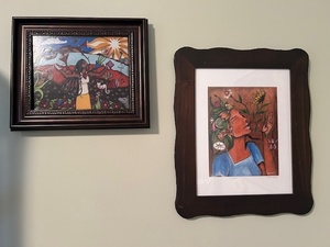 lot 113 image: Pair of Framed Colorful Art Prints Featuring Women and Nature