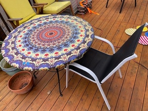 lot 134 image: Round Glass Patio Table with Mandala Tablecloth