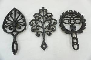 lot 129 image: Vintage Cast Iron Trivets