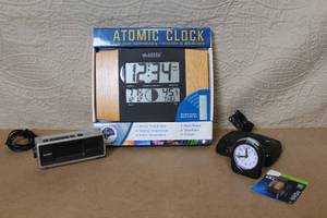 lot 28 image: Assorted Alarm Clocks and La Crosse Atomic Wall Clock Set