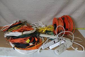 lot 54 image: Large Assortment of Extension Cords, Reel Reels, Power Strips and Landscape Cable