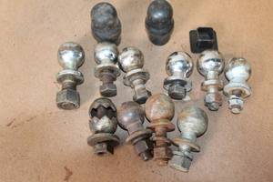 lot 85 image: Collection of Trailer Hitch Balls and Covers