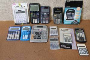 lot 93 image: Collection of 13 Assorted Calculators Including Texas Instruments, Casio, and Sharp