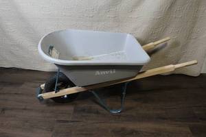 lot 139 image: Anvil Poly Wheelbarrow with 5 cu ft Tray and Hardwood Handles