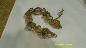 lot 49 image: Gold Chain Wrapped Bracelet & Earring