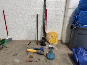 lot 36 image: Miscellaneous Tools Hi-Lift Heavy Duty Jack (Max Load 4660 LBs), Wrenchs, Trowel, Caulk Gun, Paint Roller, Safety Light Covers