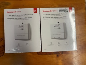 lot 98 image: Honeywell Home CT31A Non-Programmable Thermostat (Heating and Cooling) and Honeywell Home CT30A Non-Programmable Thermostat (Heating Only)