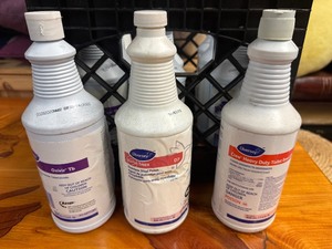 lot 100 image: Diversey Oxivir TB General Sanitizer (Qty 8), Diversey Suma Inox Stainless Steel Cleaner (Qty 2), Diversey Crew Heavy Duty Toilet Cleaner (Qty 1)
