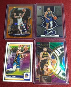 lot 61 image: (4) Stephen Curry Cards - (2) Prizms