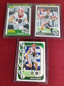 lot 102 image: (3) Score Brock Bowers Rookie Cards