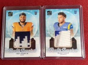 lot 125 image: (2) Football Rookie Sweaters Cards