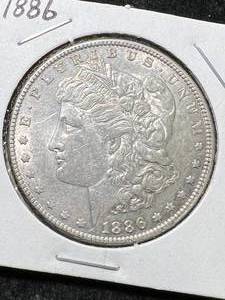lot 30 image: 1886 US MORGAN SILVER DOLLAR