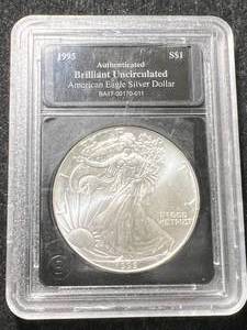 lot 75 image: 1995 AMERICAN SILVER EAGLE 1 TROY OZ .999 FINE SILVER SLABBED BU