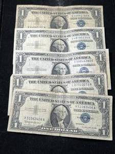 lot 87 image: 5 US BLUE SEAL $1 SILVER CERTIFICATES