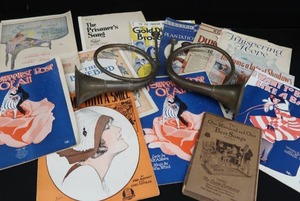 lot 30 image: 2 VINTAGE BRASS FRENCH HORNS PLUS SHEET MUSIC.