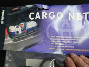 lot 115 image: NEW IN PKG RAV 4 HIDEAWAY CARGO NET