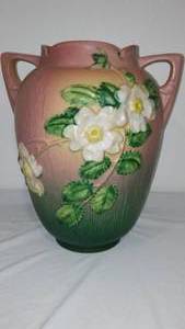 lot 921 image: Antique Roseville Pottery White Rose Vase.