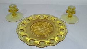 lot 971 image: Vintage Amber Depression Glass Thumb Plate and Candle Holders (2).