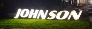 lot 660 image: Lighted Johnson Sign