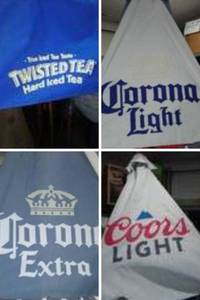 lot 688 image: Coors, Michelob, Bud and More Outdoor Umbrella Poles and Covers (8), Base (1).