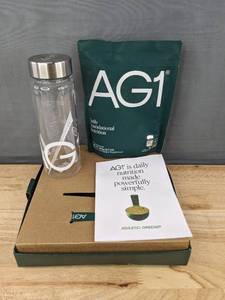 lot 83 image: AG1 Greens Powder Starter Kit, $105 Retail - Brand New