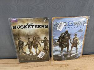 lot 164 image: 2 Metal 8 x 12in Signs The Musketeers and God of War Ragnarok - Brand New