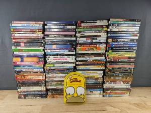 lot 1E image: 136 DVDs - Assorted Movies and TV Series - Simpsons, NCIS, Cosby, 27 Dresses C