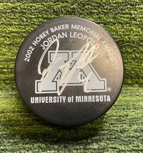 lot 129 image: 2002 Hobey Baker Memorial Award Jordan Leopold Autograph Puck