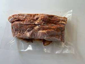 lot 81 image: BB. 2lbs OlSmokehouse Honey Orange Uncured Bacon Ends & Pieces