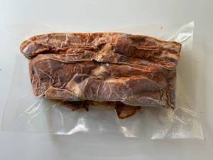 lot 83 image: BB. 2lbs OlSmokehouse Honey Orange Uncured Bacon Ends & Pieces