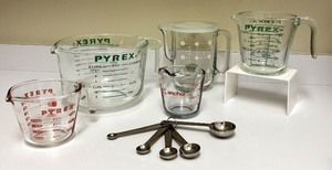 lot 40 image: PTRY - Collection of 5 Glass Measuring Cups and Williams Sonoma Stainless Measuring Spoons