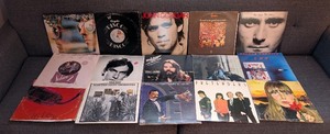 lot 154 image: UL - Collection of 14 Classic Rock Vinyl Records Featuring George Harrison, ELO, John Cougar, and More