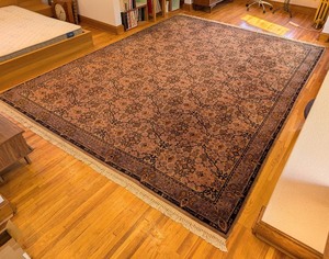 lot 119 image: UL - Large Wool Area Rug with Floral Pattern