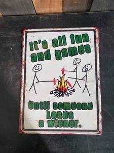 lot 69 image: Its all Fun and Games Embossed Metal Sign