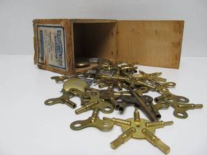 lot 15 image: Large Estate Lot of Vintage & Antique Antique Clock Keys & Some Pendulums