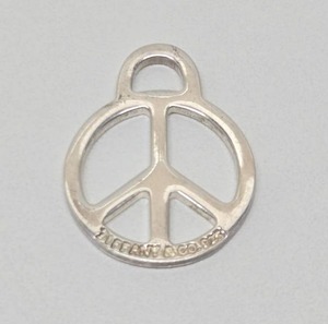 lot 166 image: Signed TIFFANY & CO Sterling Silver Peace Sign Pendant