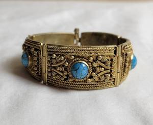 lot 44 image: Vintage Bent Gold Coiled Wire with Turquoise Bracelet
