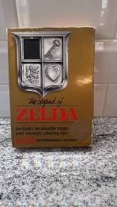 lot 7 image: The Legend of Zelda NES Gold Cartridge with Original Box and Sleeve