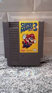 lot 18 image: Super Mario Bros. 3 Nintendo NES Game Cartridge with Sleeve