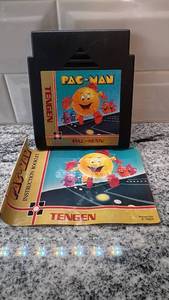 lot 24 image: Tengen Pac-Man NES Game Cartridge with Instruction Booklet, Untested