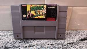 lot 54 image: Zombies Ate My Neighbors SNES Cartridge with FuncoLand Sleeve - Untested
