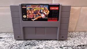 lot 57 image: Street Fighter II Turbo SNES Game Cartridge with FuncoLand Sleeve