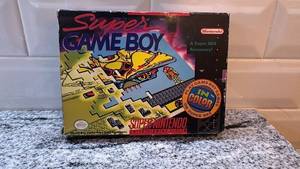 lot 71 image: Super Game Boy Adapter for Super Nintendo with Box and Manual