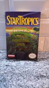 lot 77 image: Nintendo StarTropics NES Game Cartridge with Box and Manual