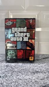 lot 92 image: Grand Theft Auto III PC Game with Box, Manuals, and Discs
